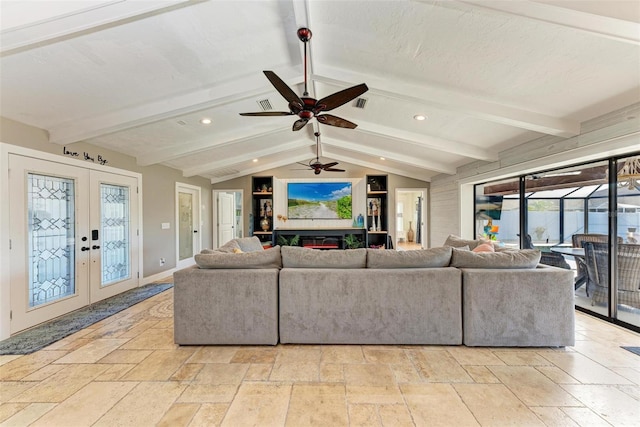 living room with french doors, lofted ceiling with beams, and ceiling fan