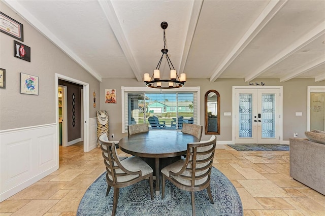 dining room with french doors, an inviting chandelier, and lofted ceiling with beams