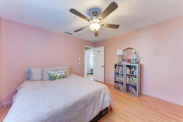 bedroom featuring ceiling fan and light hardwood / wood-style flooring