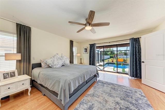 bedroom with ceiling fan, light hardwood / wood-style floors, and access to outside