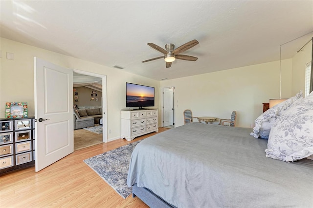 bedroom with ceiling fan and light hardwood / wood-style floors