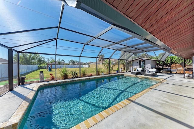 view of pool with a lanai and a patio area