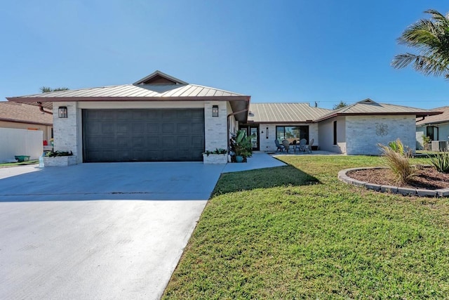 single story home with a garage and a front yard