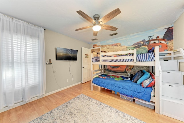 bedroom with hardwood / wood-style flooring and ceiling fan