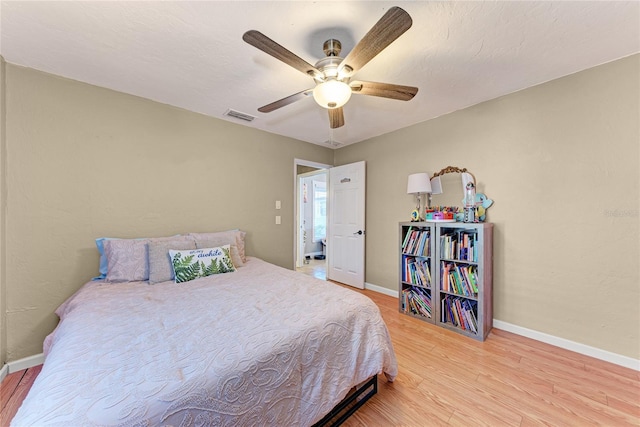 bedroom featuring ceiling fan and light hardwood / wood-style flooring