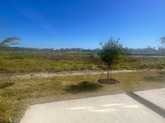 view of yard with a rural view