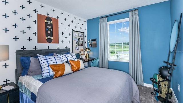 carpeted bedroom featuring a textured ceiling