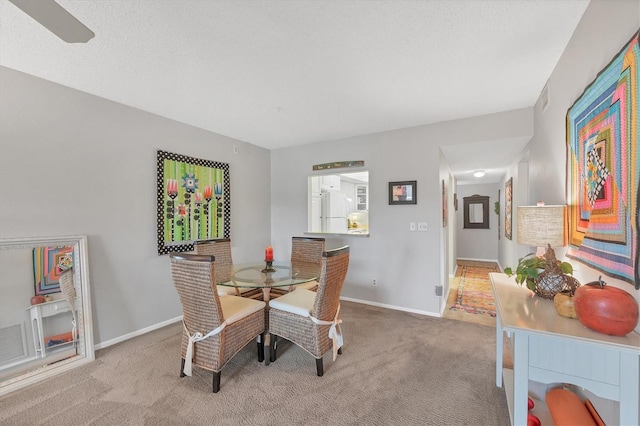 view of carpeted dining area