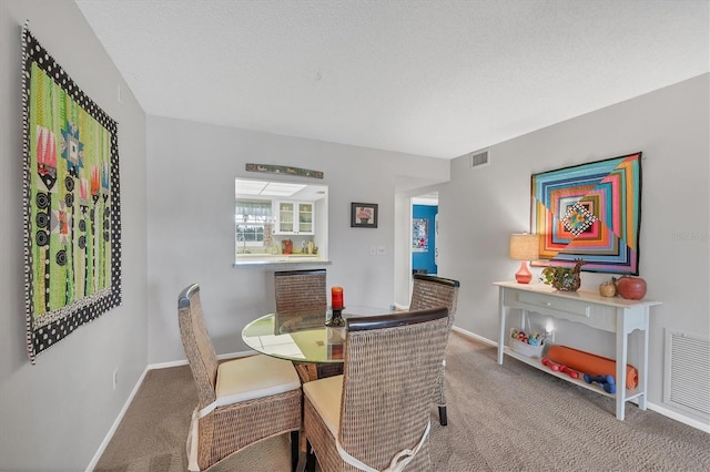 dining room featuring carpet floors