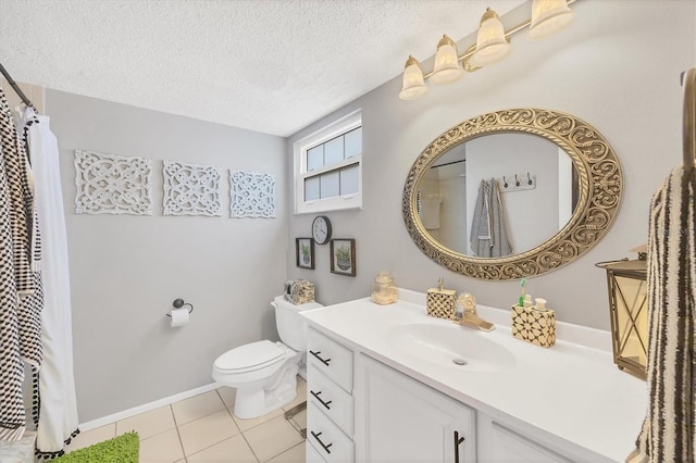 bathroom featuring tile patterned flooring, vanity, toilet, and a textured ceiling