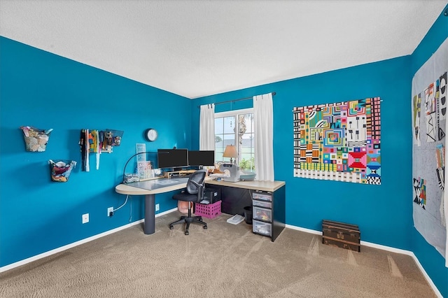 office area with carpet flooring and a textured ceiling