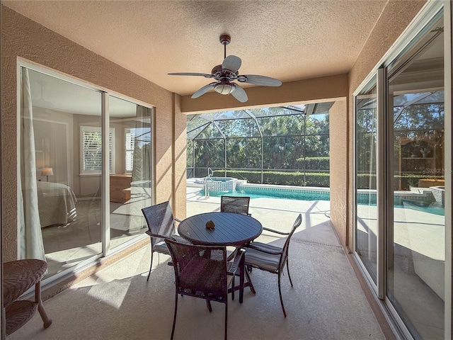 sunroom featuring a swimming pool