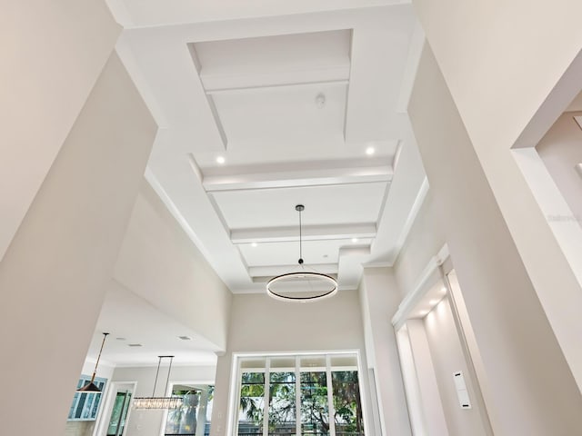 interior details with beamed ceiling and an inviting chandelier