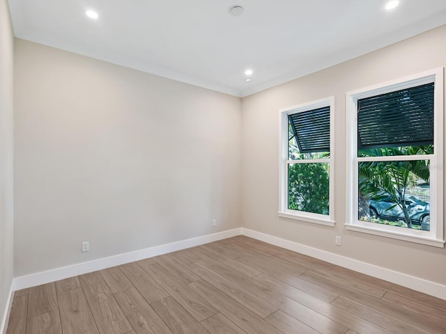 spare room featuring light hardwood / wood-style flooring