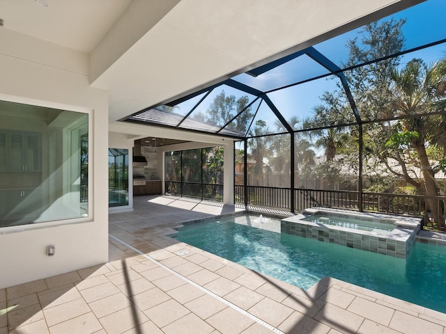 view of pool featuring a lanai, a patio area, and an in ground hot tub