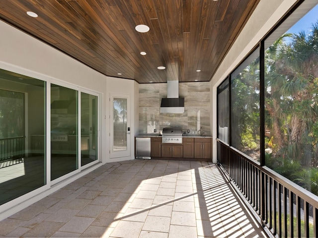 unfurnished sunroom featuring wood ceiling