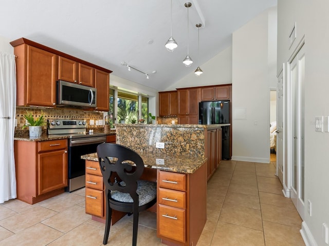 kitchen featuring light tile patterned floors, backsplash, stainless steel appliances, and dark stone countertops