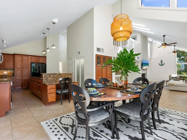 1214 Sea Plume Way, Sarasota, FL 34242 - dining space featuring high vaulted ceiling, light tile patterned floors, and a ceiling fan