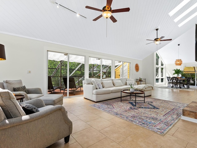 living area with high vaulted ceiling, light tile patterned flooring, a skylight, and wooden ceiling