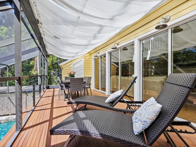 wooden deck featuring outdoor dining space