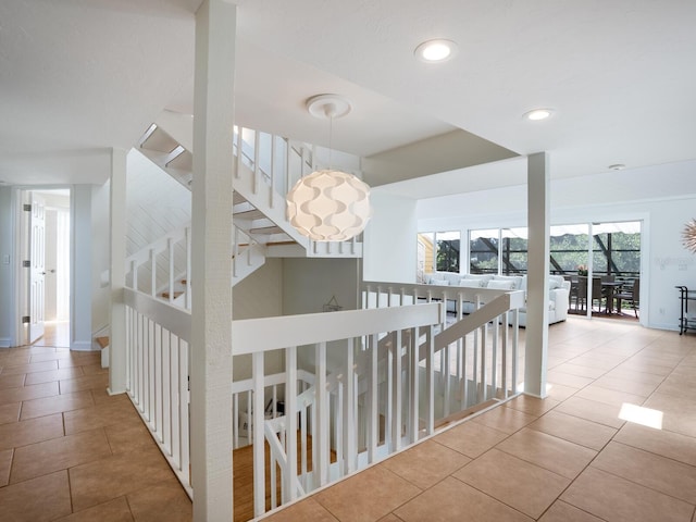 corridor with recessed lighting and tile patterned floors