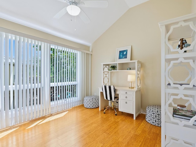 home office with light wood-style floors, vaulted ceiling, and a ceiling fan