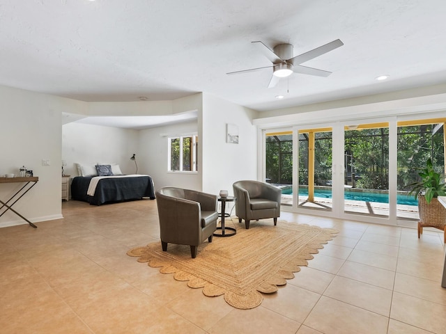 bedroom featuring ceiling fan, light tile patterned floors, and access to outside