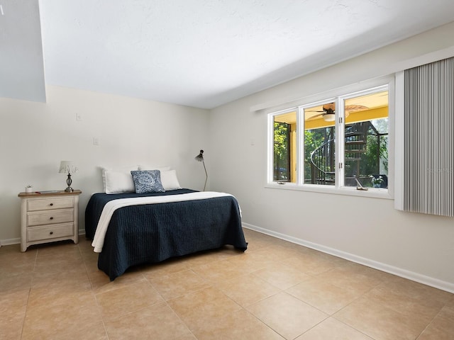 bedroom featuring light tile patterned floors