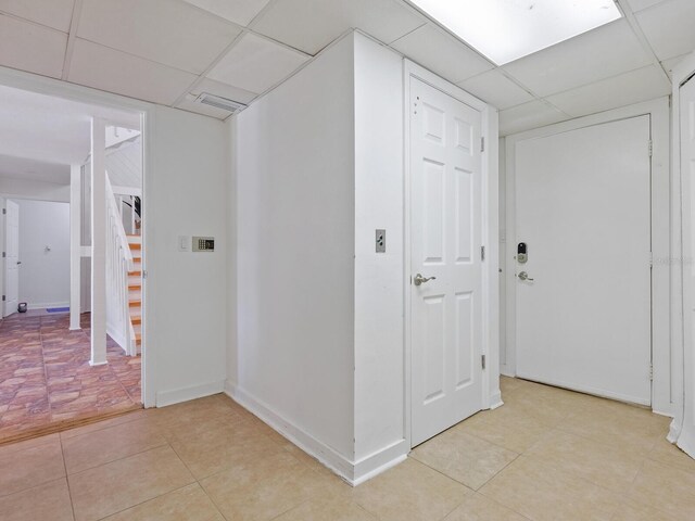 1214 Sea Plume Way, Sarasota, FL 34242 - corridor with a drop ceiling, stairs, and light tile patterned floors