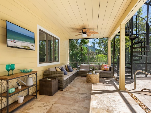 sunroom with wooden ceiling and a ceiling fan