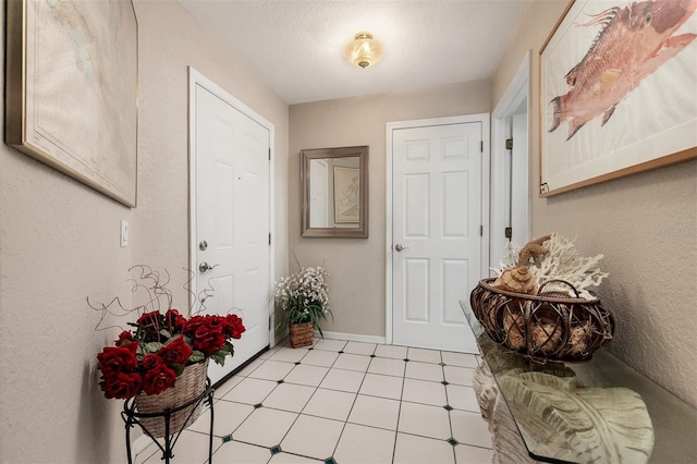 entryway with a textured ceiling