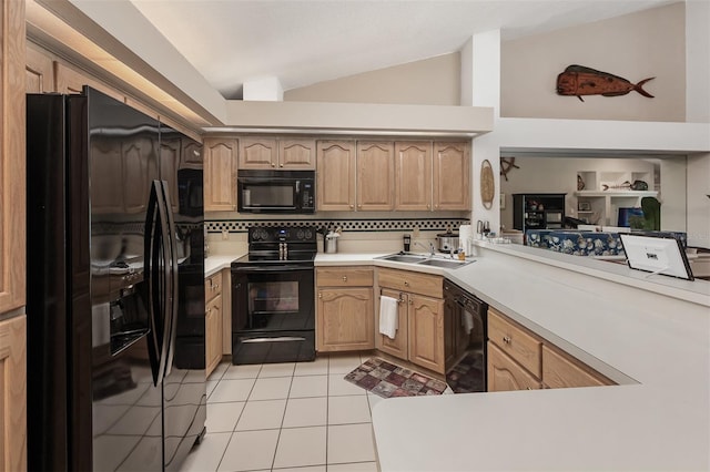 kitchen with black appliances, decorative backsplash, sink, and vaulted ceiling