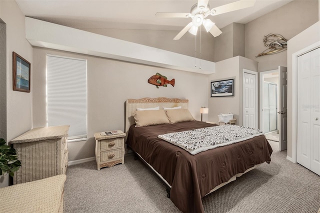 bedroom with ceiling fan, carpet floors, and lofted ceiling