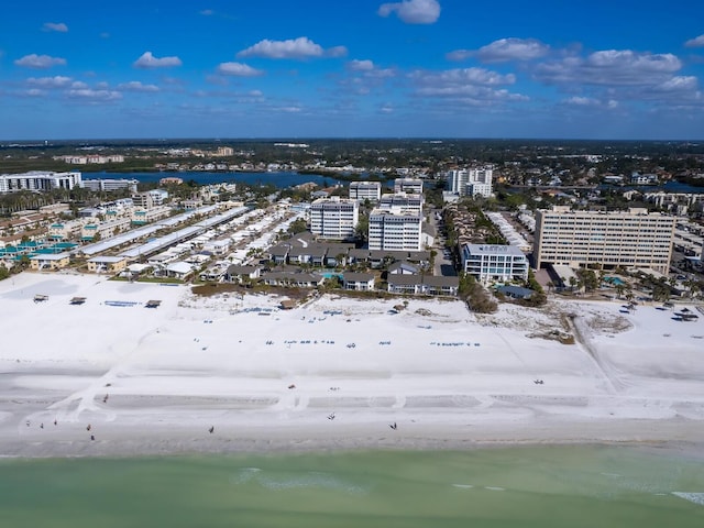 birds eye view of property featuring a water view and a view of the beach