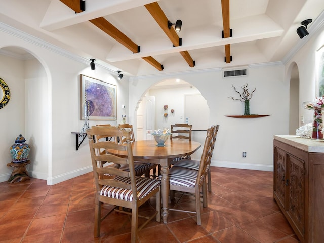 tiled dining room with beam ceiling