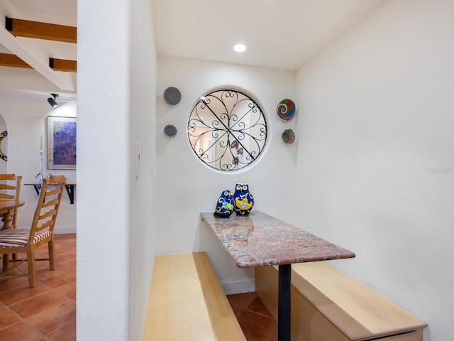 hall featuring light tile patterned floors