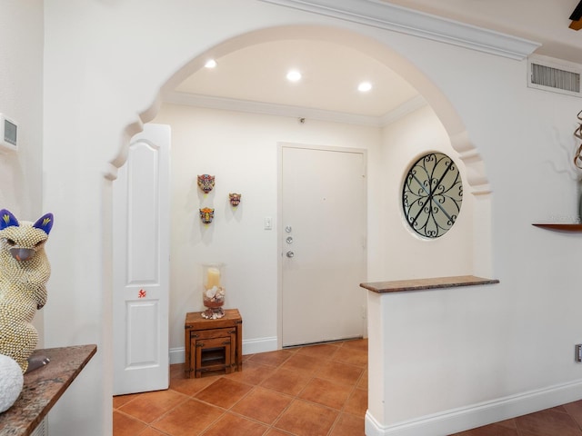 tiled entryway with ornamental molding