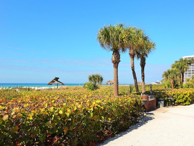 surrounding community featuring a water view