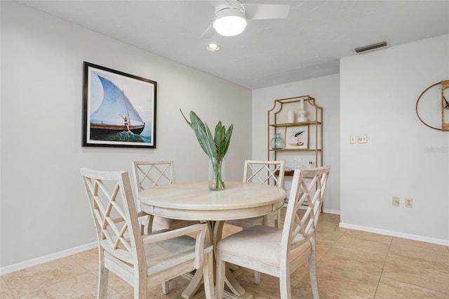 tiled dining room with ceiling fan