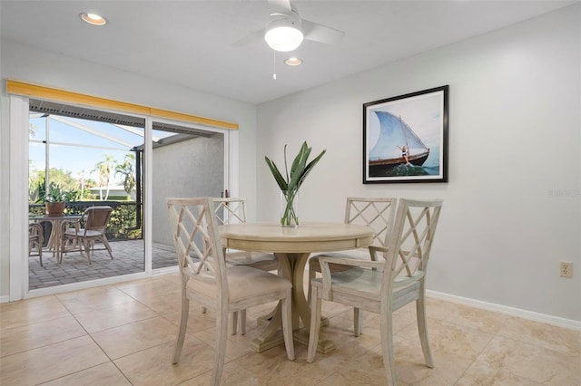 tiled dining room with ceiling fan