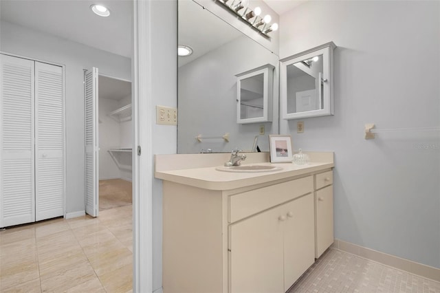 bathroom featuring tile patterned flooring and vanity