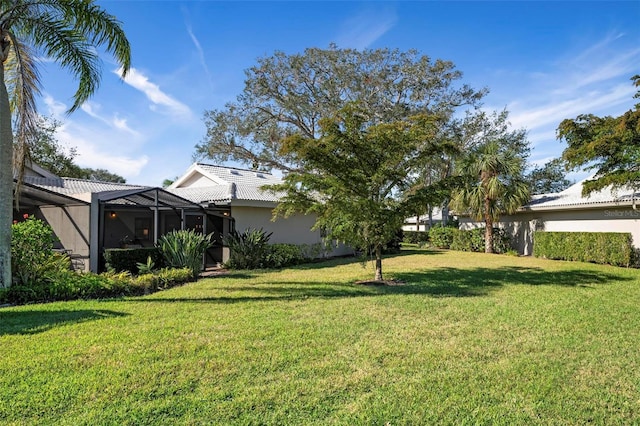 view of yard featuring glass enclosure