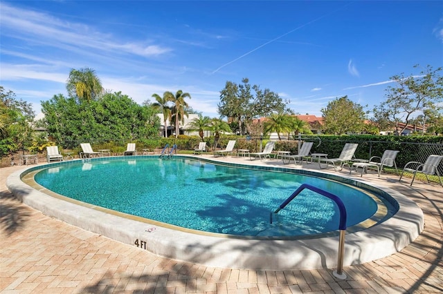 view of pool featuring a patio area