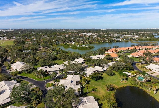 drone / aerial view with a water view