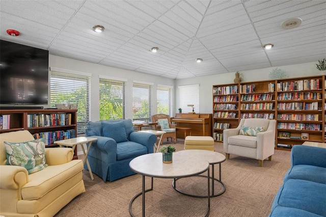 sitting room featuring light colored carpet