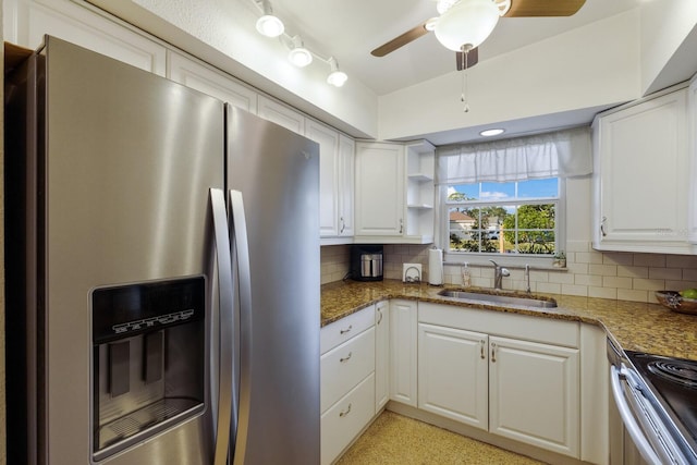 kitchen with tasteful backsplash, white cabinetry, sink, and stainless steel appliances