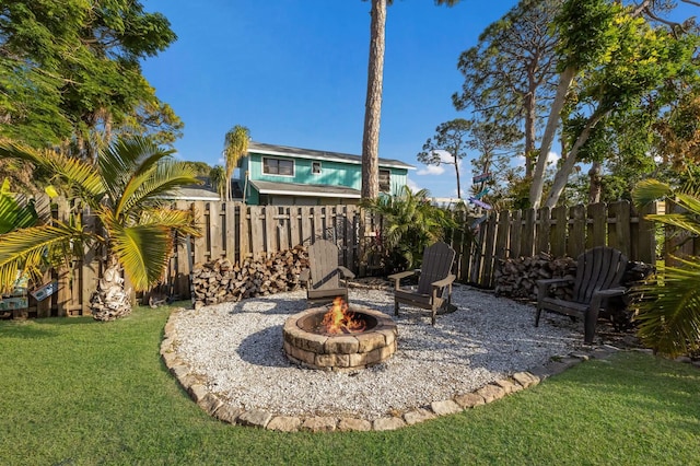 view of yard featuring a fire pit and a patio area