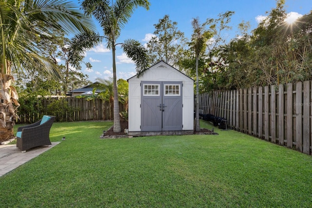 view of outbuilding featuring a lawn