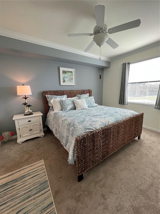 carpeted bedroom featuring ceiling fan and ornamental molding