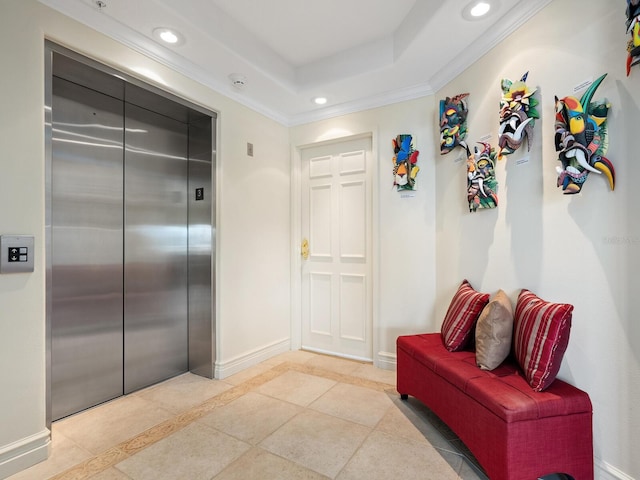 hall with a raised ceiling, elevator, crown molding, and tile patterned floors